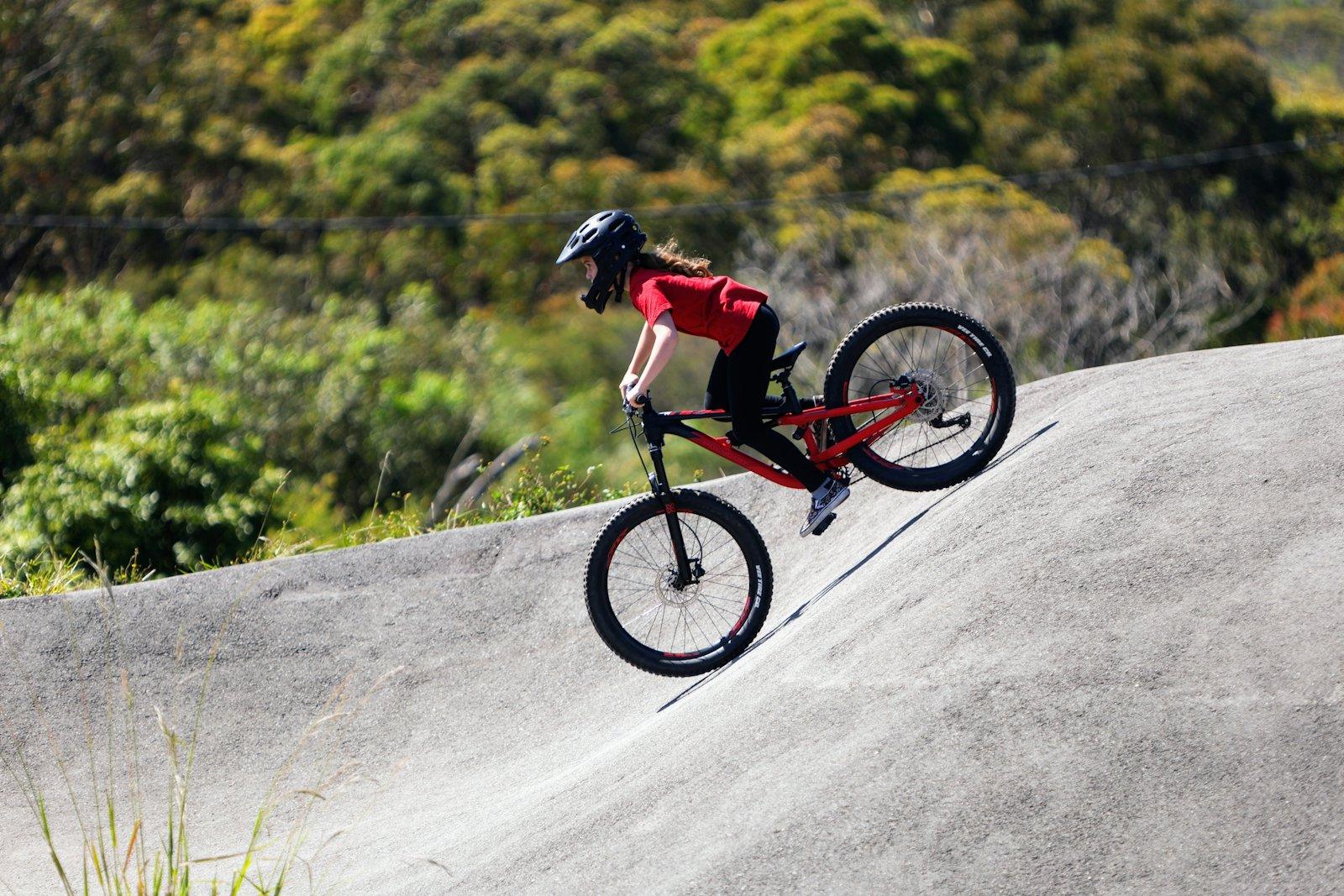 Young rider on a bike pump track